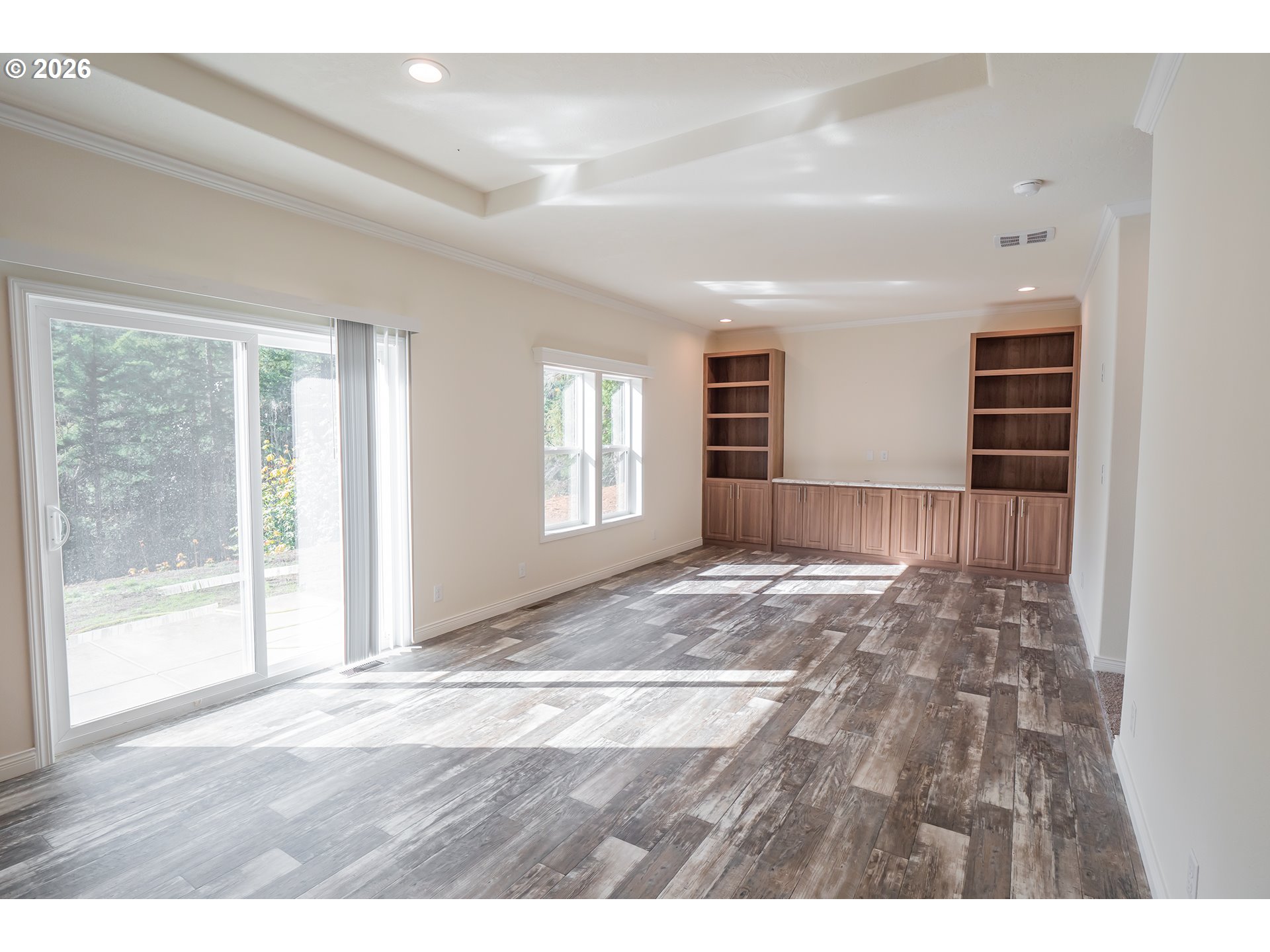 42276 Winberry Creek Road Fall Creek, OR 97438 - Photo 4 of 30 a view of an empty room with wooden floor and a window
