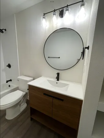 a bathroom with a sink and mirror