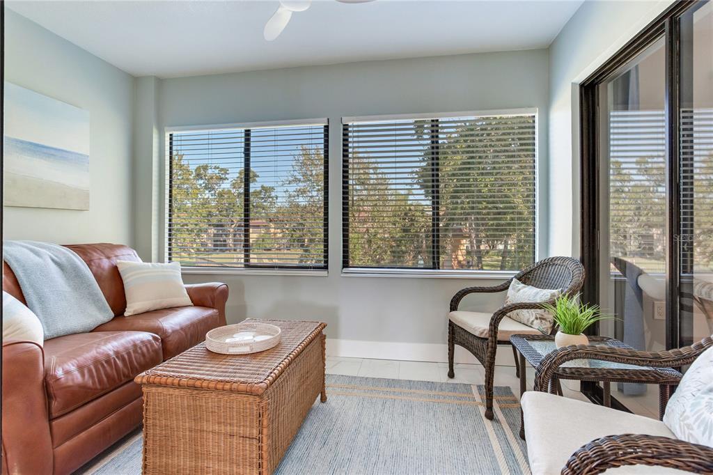 12900 Vonn Road, Unit A204 Largo, FL 33774 - Photo 11 of 40 a living room with furniture and a large window