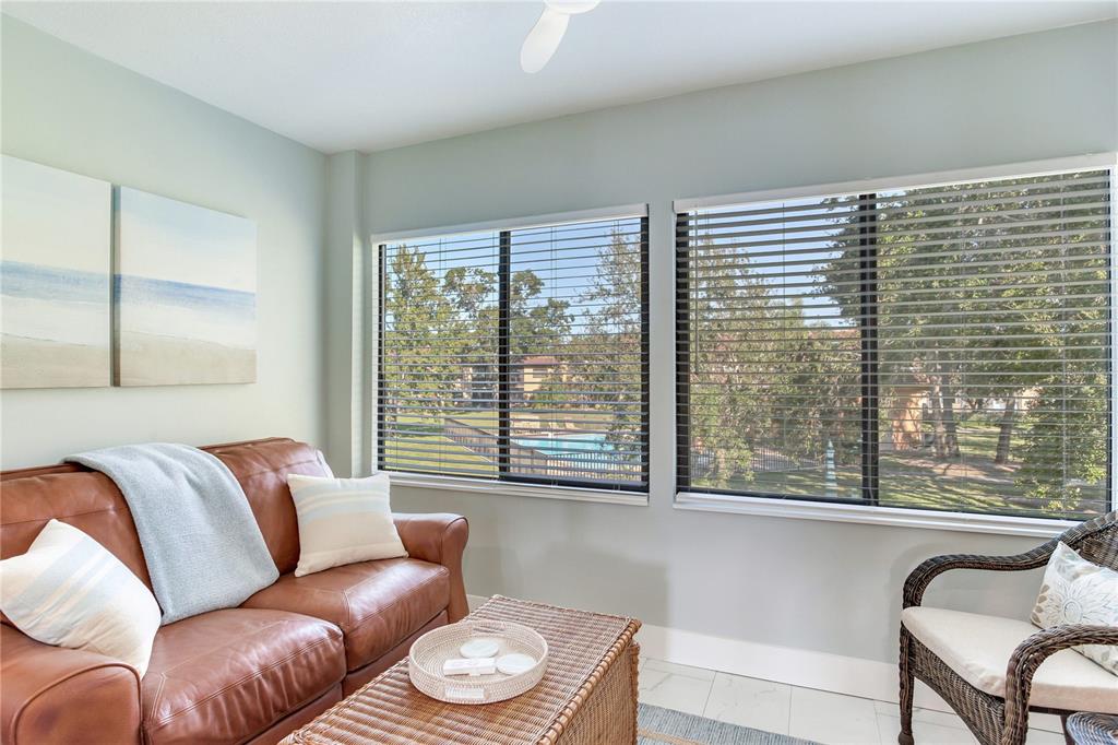12900 Vonn Road, Unit A204 Largo, FL 33774 - Photo 12 of 40 a living room with furniture and a window
