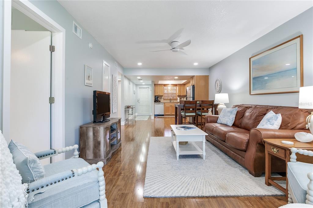 12900 Vonn Road, Unit A204 Largo, FL 33774 - Photo 15 of 40 a living room with furniture and a flat screen tv
