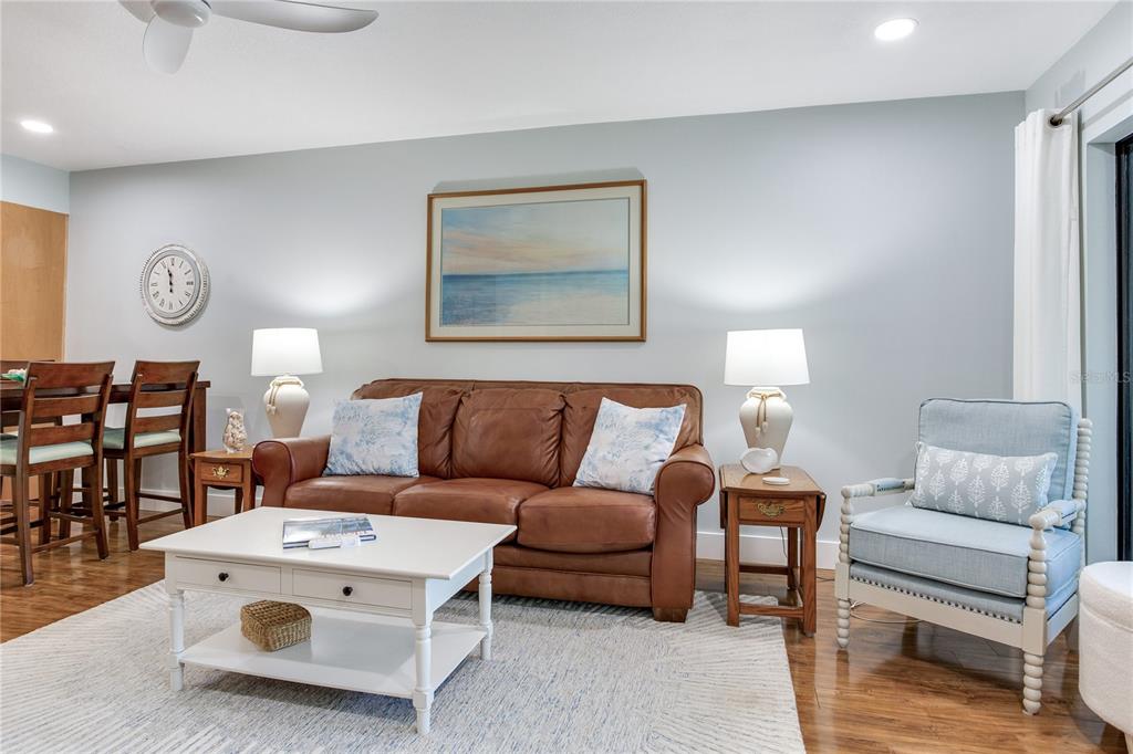 12900 Vonn Road, Unit A204 Largo, FL 33774 - Photo 16 of 40 a living room with furniture and a lamp