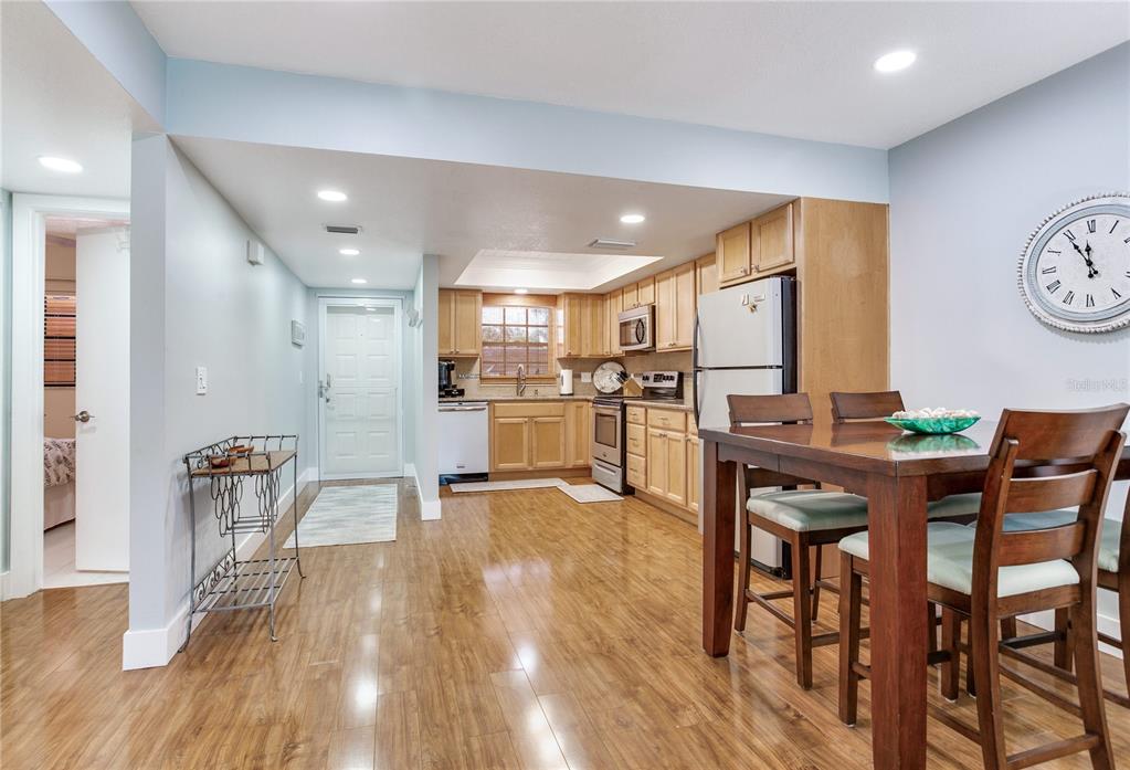 12900 Vonn Road, Unit A204 Largo, FL 33774 - Photo 19 of 40 a kitchen with a table and chairs in it