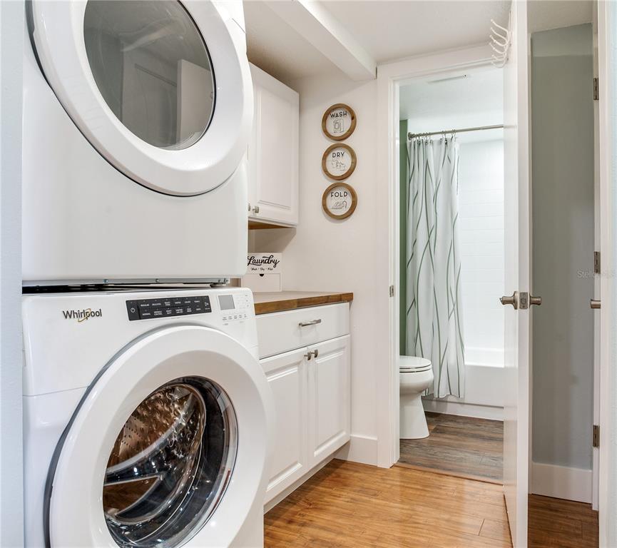 12900 Vonn Road, Unit A204 Largo, FL 33774 - Photo 25 of 40 a view of a hallway with washer and dryer