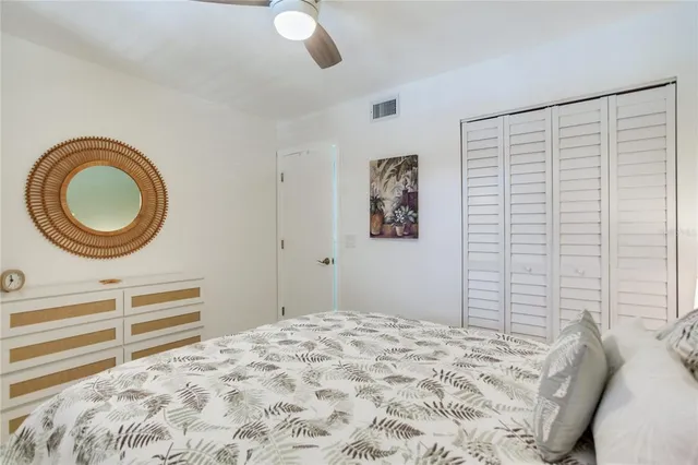 a bedroom with a bed and a cabinets