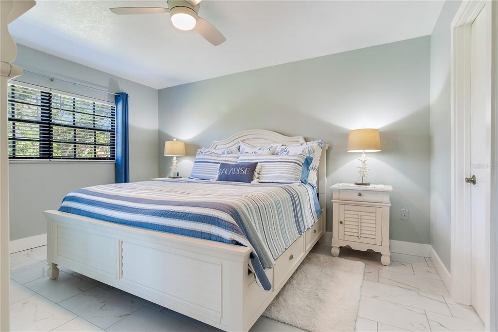 12900 Vonn Road, Unit A204 Largo, FL 33774 - Photo 29 of 40 a bedroom with a bed and a cabinets