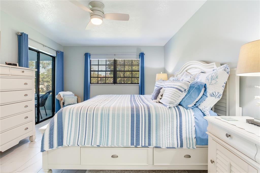 12900 Vonn Road, Unit A204 Largo, FL 33774 - Photo 30 of 40 a bedroom with a bed and a dresser