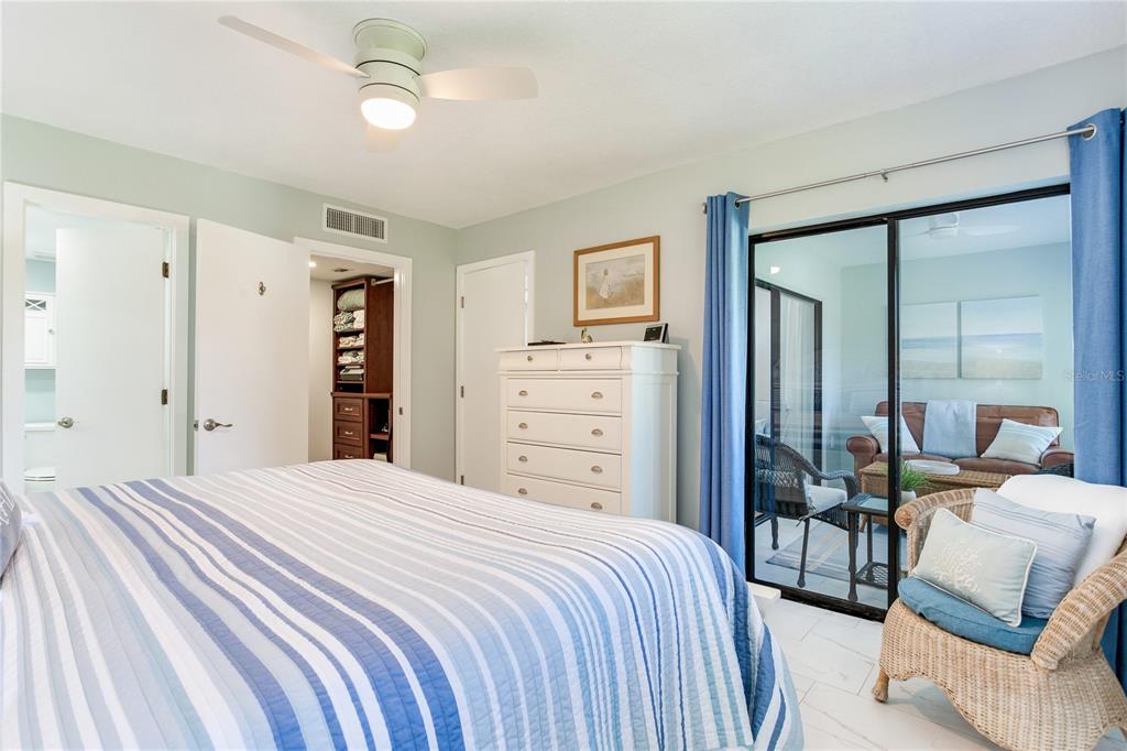 12900 Vonn Road, Unit A204 Largo, FL 33774 - Photo 32 of 40 a bedroom with a bed and a couch