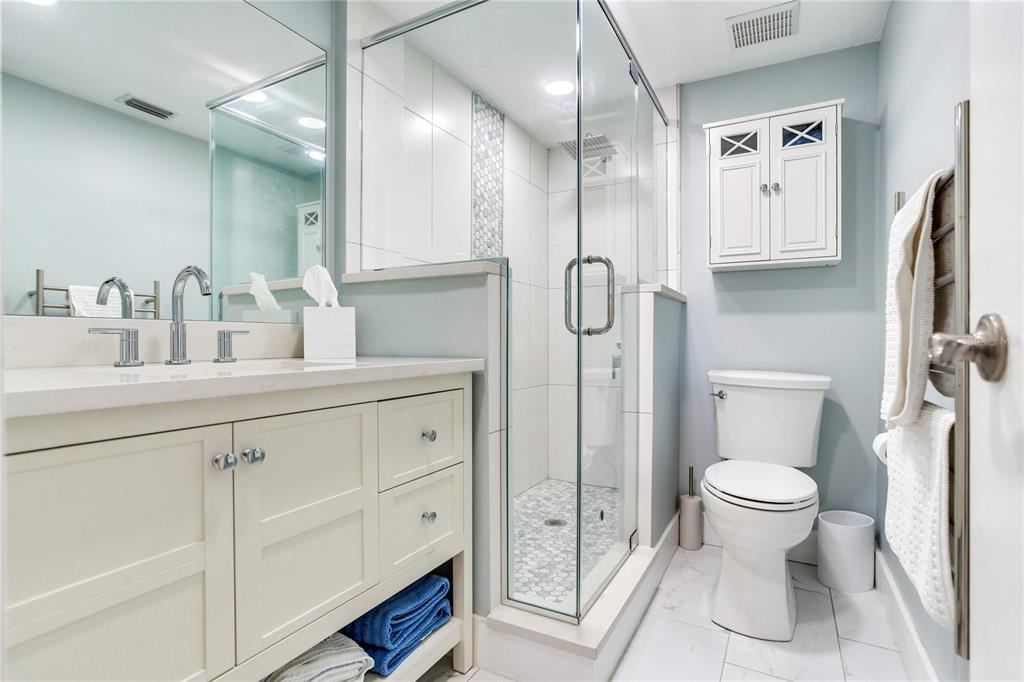 12900 Vonn Road, Unit A204 Largo, FL 33774 - Photo 33 of 40 a bathroom with a toilet sink and double vanity