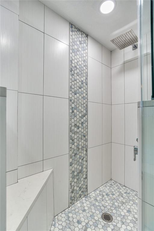12900 Vonn Road, Unit A204 Largo, FL 33774 - Photo 34 of 40 a bathroom with a shower