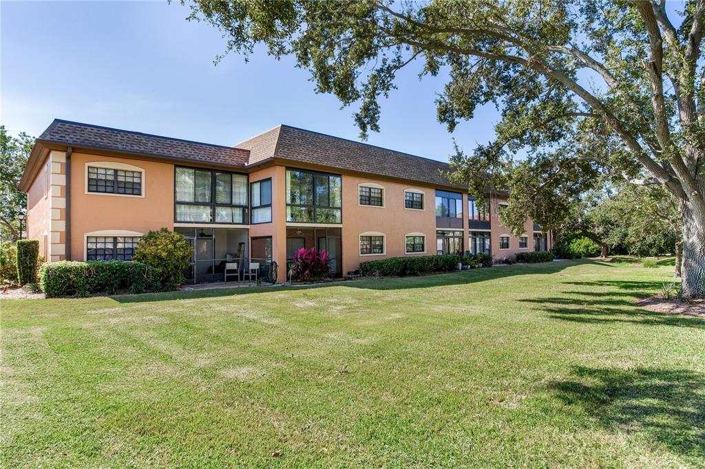 12900 Vonn Road, Unit A204 Largo, FL 33774 - Photo 35 of 40 a front view of a house with a garden