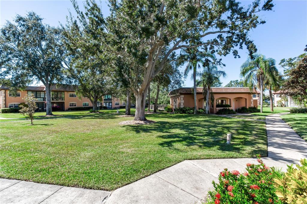 12900 Vonn Road, Unit A204 Largo, FL 33774 - Photo 36 of 40 a front view of a house with a garden