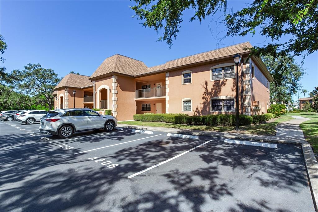 12900 Vonn Road, Unit A204 Largo, FL 33774 - Photo 40 of 40 a front view of a house with a yard