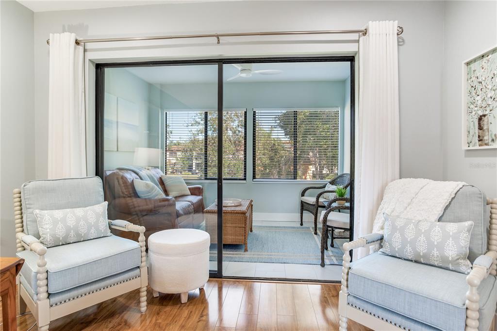 12900 Vonn Road, Unit A204 Largo, FL 33774 - Photo 10 of 40 a living room with furniture and a large window
