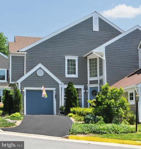 1550 Deer Point Way Reston, VA 20194 - Photo 1 of 30 a front view of a house with a garden and plants