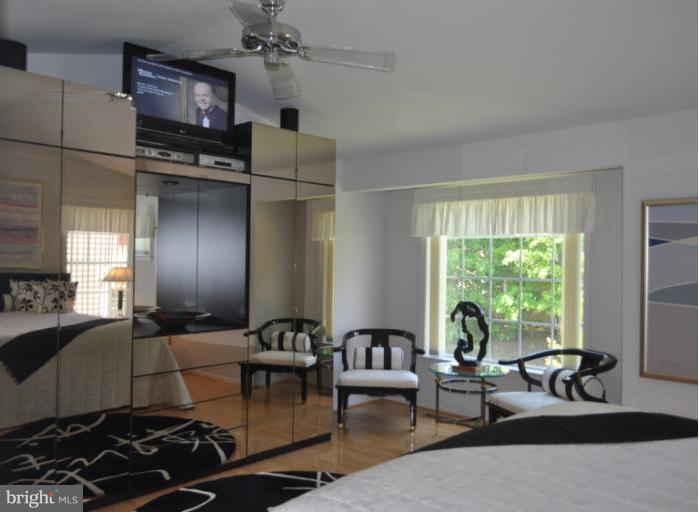 1550 Deer Point Way Reston, VA 20194 - Photo 23 of 30 a living room with furniture and a flat screen tv