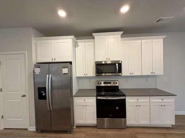 a kitchen with a sink and cabinets