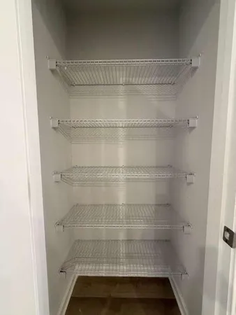 a bathroom with a toilet sink and a mirror