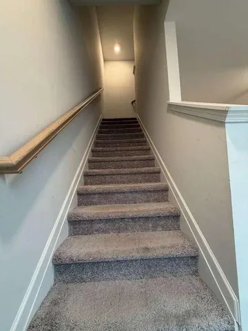 an empty room with a empty space and a ceiling fan