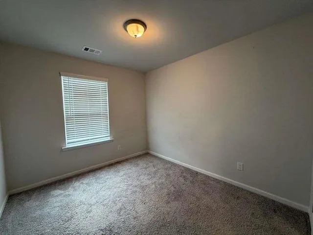 a bathroom with a sink toilet and mirror