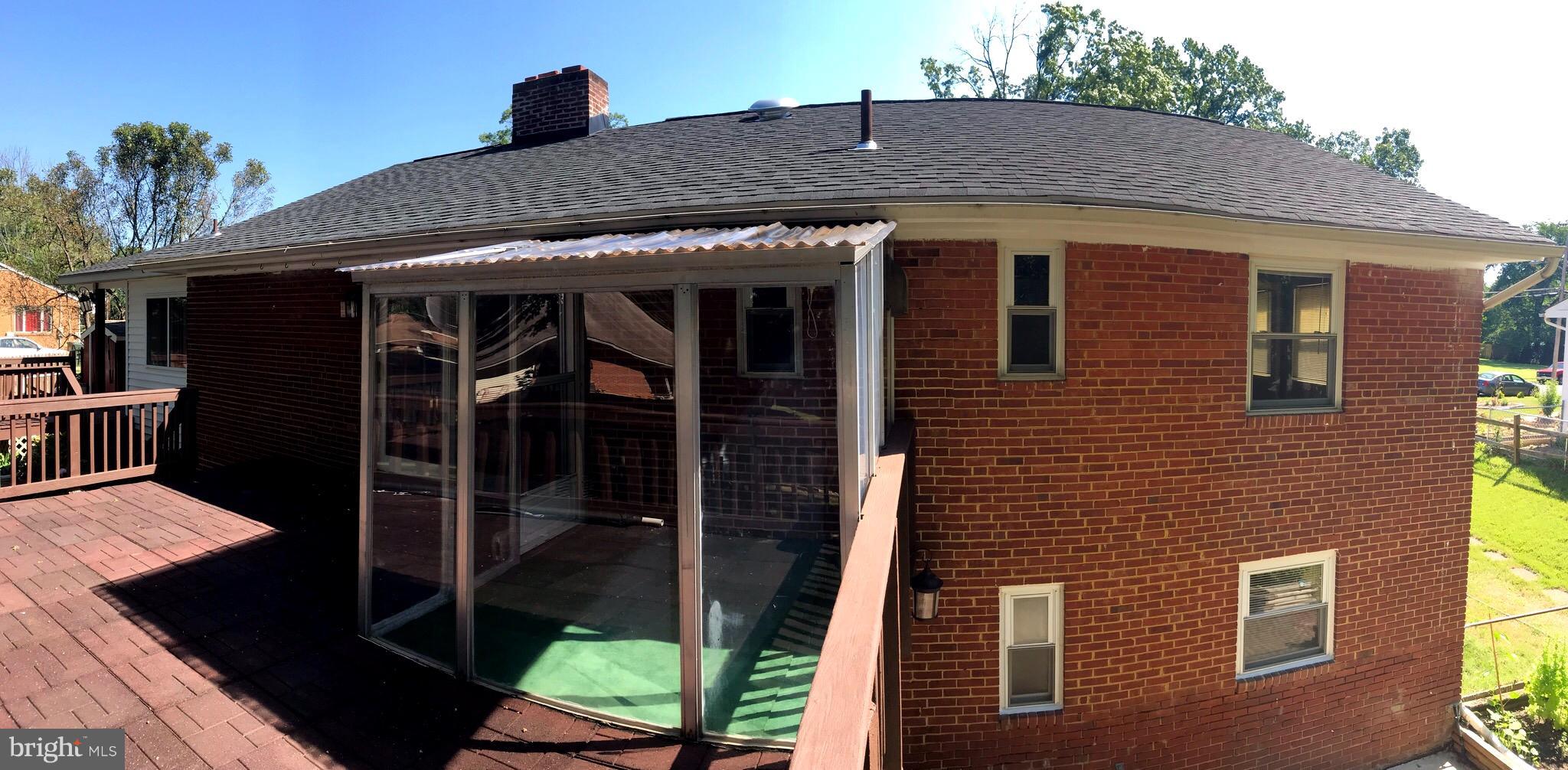 7437 Axton Street Springfield, VA 22151 - Photo 22 of 26 a front view of a house with garden
