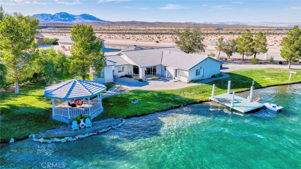 43625 Mannix Road Newberry Springs, CA 92365 - Photo 1 of 1 an aerial view of a house with a garden and trees