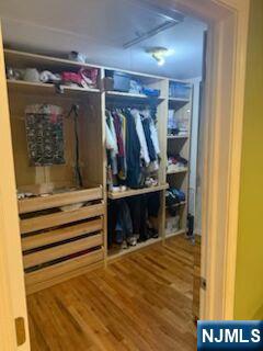 59 Spring Valley Avenue Hackensack, NJ 07601 - Photo 15 of 26 a view of walk in closet with clothes and shoes