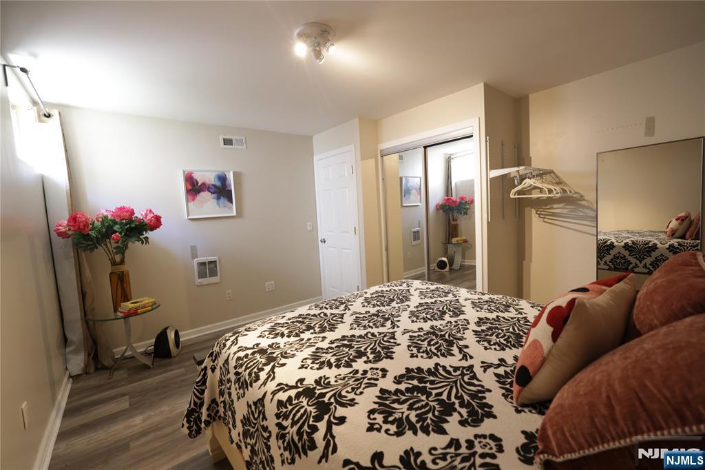 59 Spring Valley Avenue Hackensack, NJ 07601 - Photo 19 of 26 a bedroom with a bed and a dresser