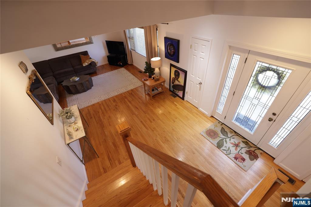 59 Spring Valley Avenue Hackensack, NJ 07601 - Photo 2 of 26 a bed room with a bed and a television