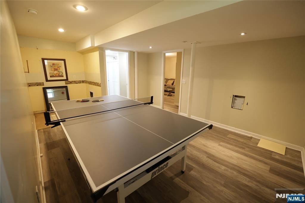 59 Spring Valley Avenue Hackensack, NJ 07601 - Photo 22 of 26 a room with pool table and windows