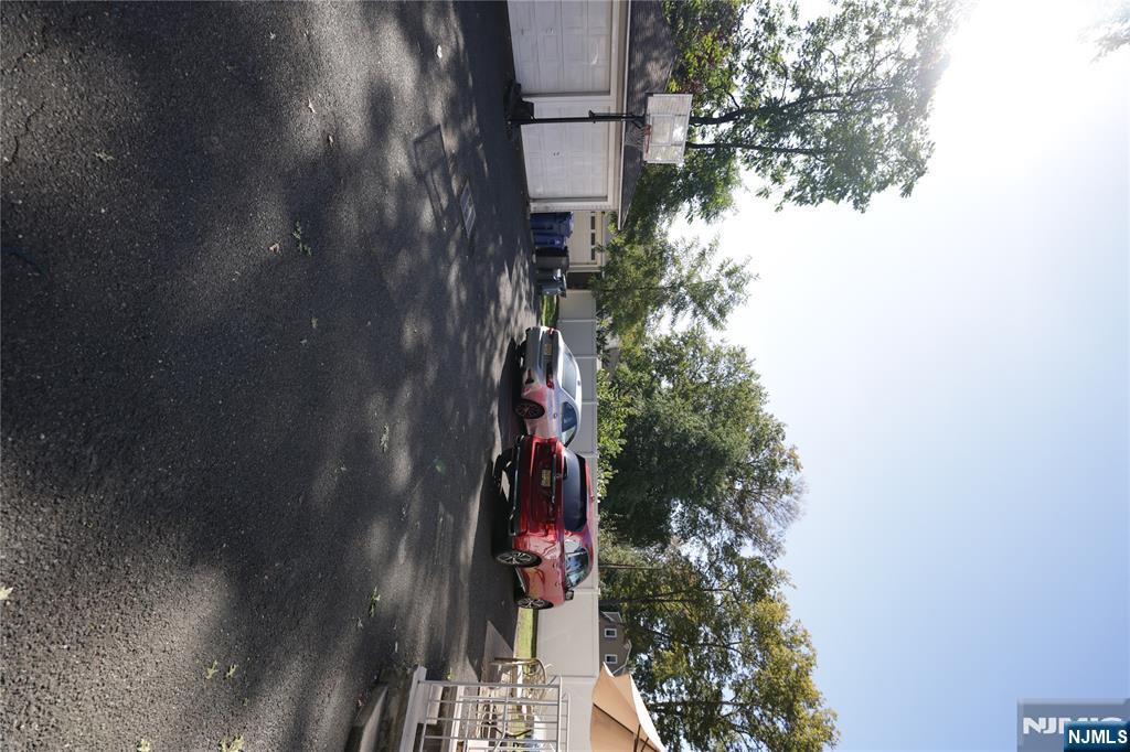 59 Spring Valley Avenue Hackensack, NJ 07601 - Photo 26 of 26 a cars parked on the side of a street