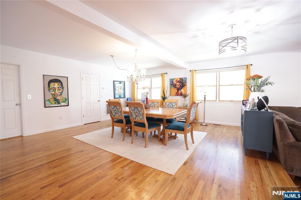 59 Spring Valley Avenue Hackensack, NJ 07601 - Photo 4 of 26 a view of a dining room with furniture and wooden floor