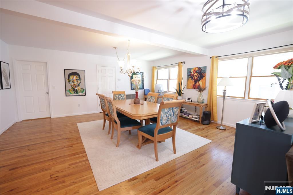 59 Spring Valley Avenue Hackensack, NJ 07601 - Photo 5 of 26 a view of a dining room with furniture and wooden floor