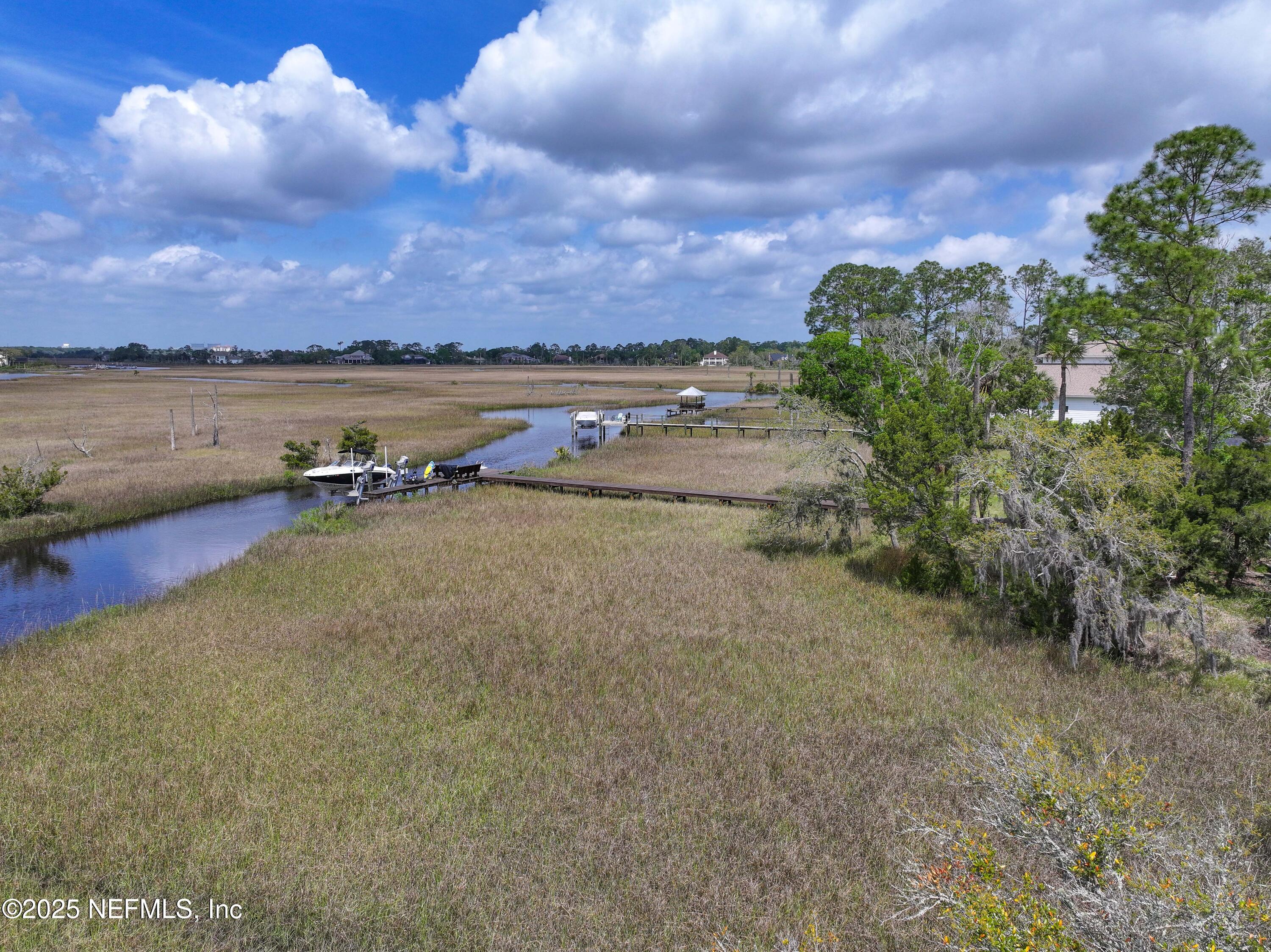24631 Deer Trace Drive Ponte Vedra Beach, FL 32082 - Photo 15 of 33 a view of a lake with houses in the back