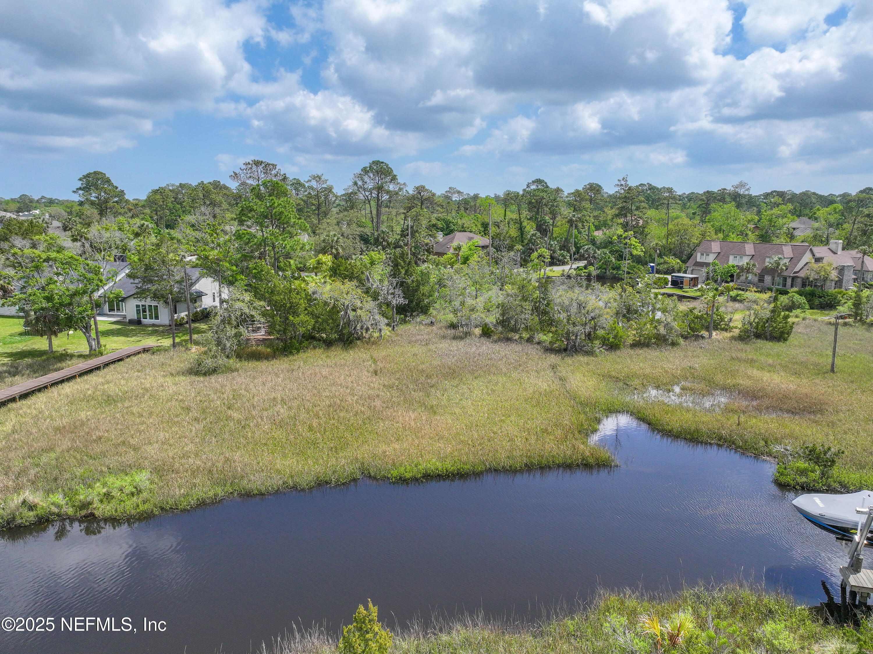 24631 Deer Trace Drive Ponte Vedra Beach, FL 32082 - Photo 16 of 33 a view of a lake with a yard