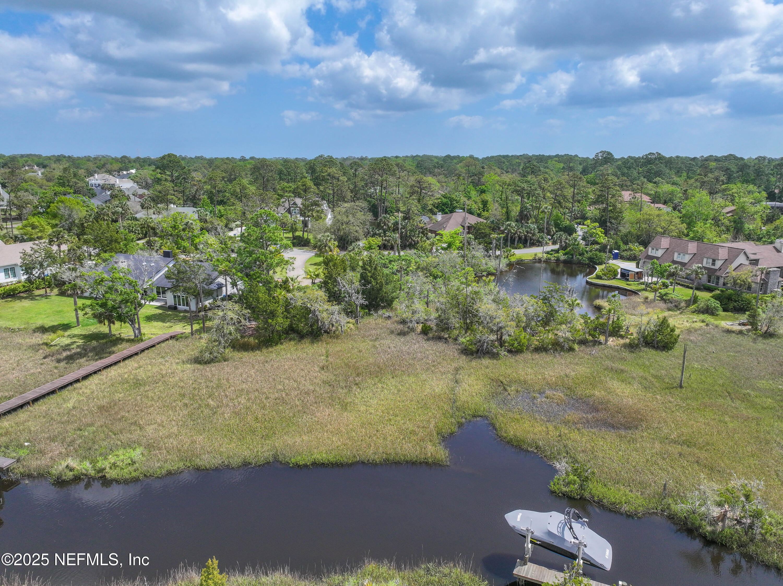 24631 Deer Trace Drive Ponte Vedra Beach, FL 32082 - Photo 19 of 33 a view of a lake with a city