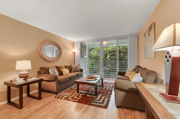 a living room with furniture and a large window