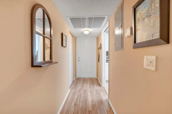 a view of entryway with wooden floor