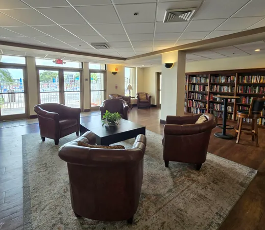 a view of a yard with plants and trees