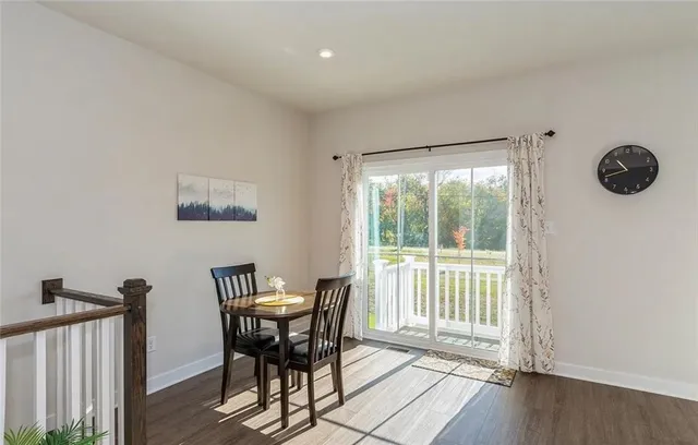 a view of a room with a table and chairs