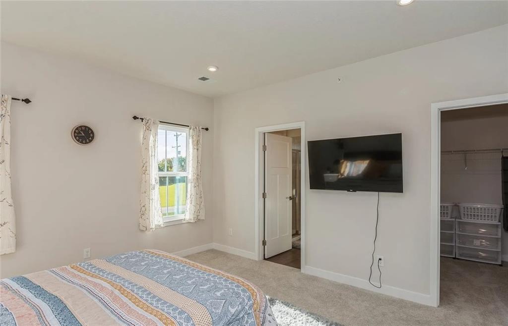 6702 Sycamore Way Gibsonia, PA 15044 - Photo 15 of 29 a bedroom with a bed and a flat screen tv