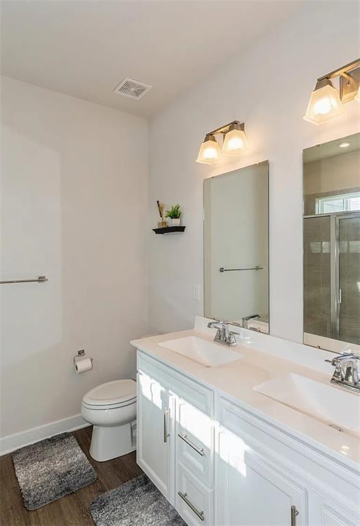 6702 Sycamore Way Gibsonia, PA 15044 - Photo 17 of 29 a bathroom with a sink a toilet and mirror