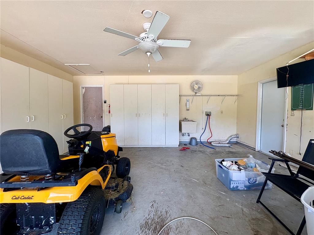 2755 Greendale Road North Port, FL 34287 - Photo 43 of 43 a room with gym equipment and a flat screen tv