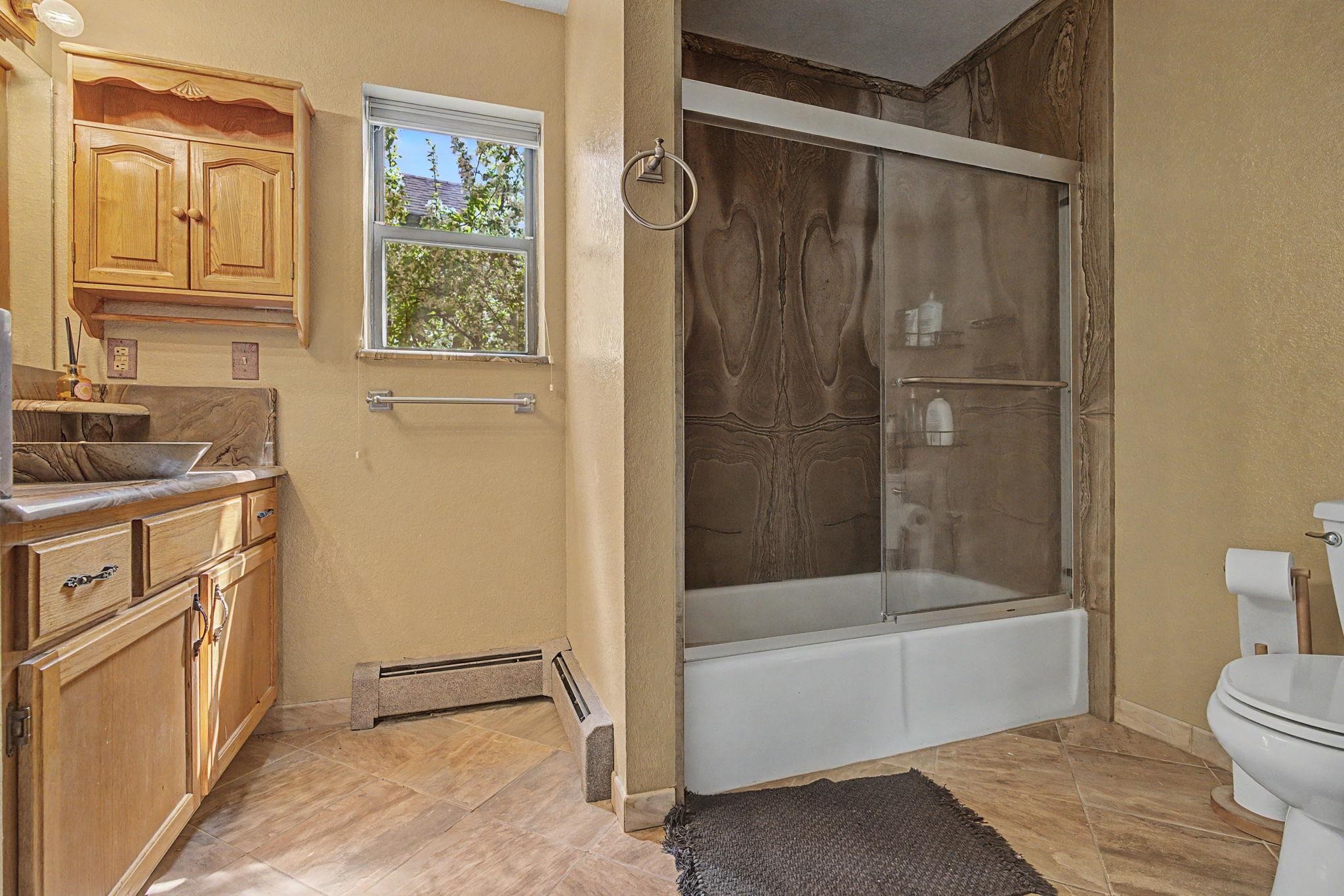 539 1/2 Ridgestone Court Grand Junction, CO 81507 - Photo 16 of 31 a bathroom with a granite countertop sink toilet and shower