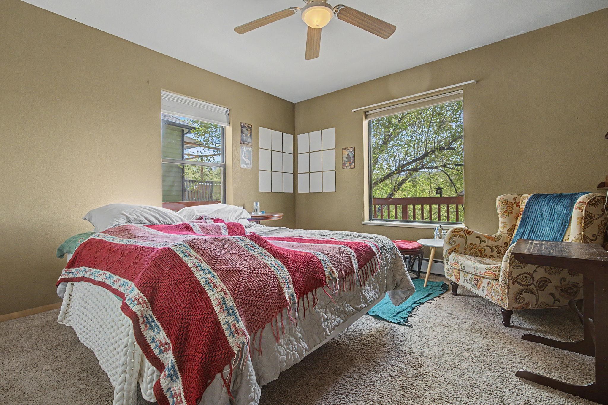 539 1/2 Ridgestone Court Grand Junction, CO 81507 - Photo 17 of 31 a bed sitting in a bedroom next to a window
