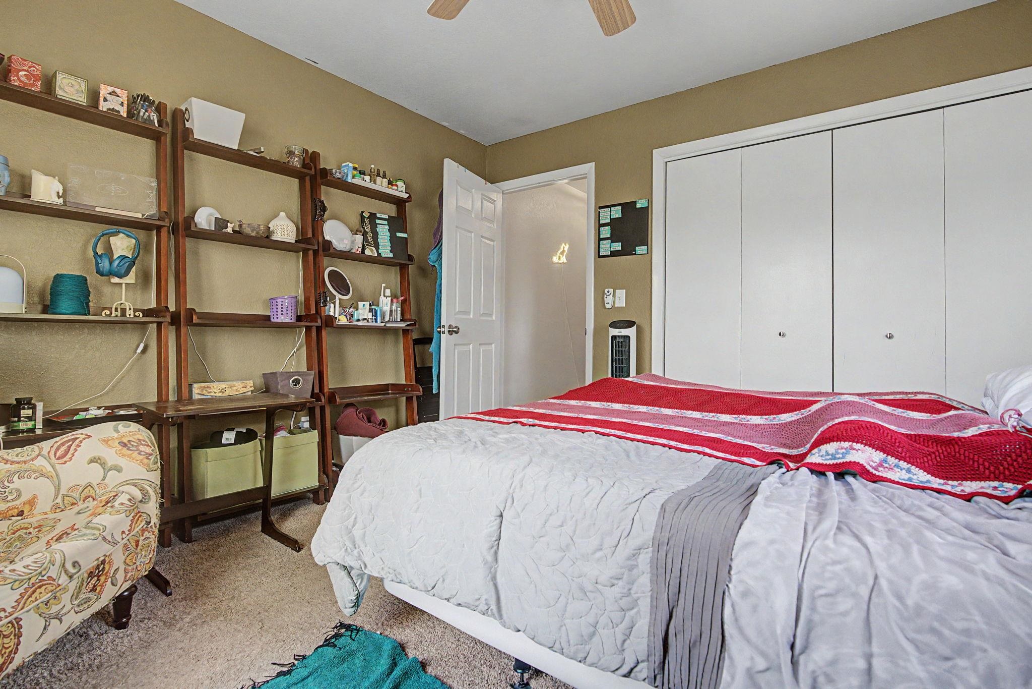 539 1/2 Ridgestone Court Grand Junction, CO 81507 - Photo 18 of 31 a bedroom with a bed and closet