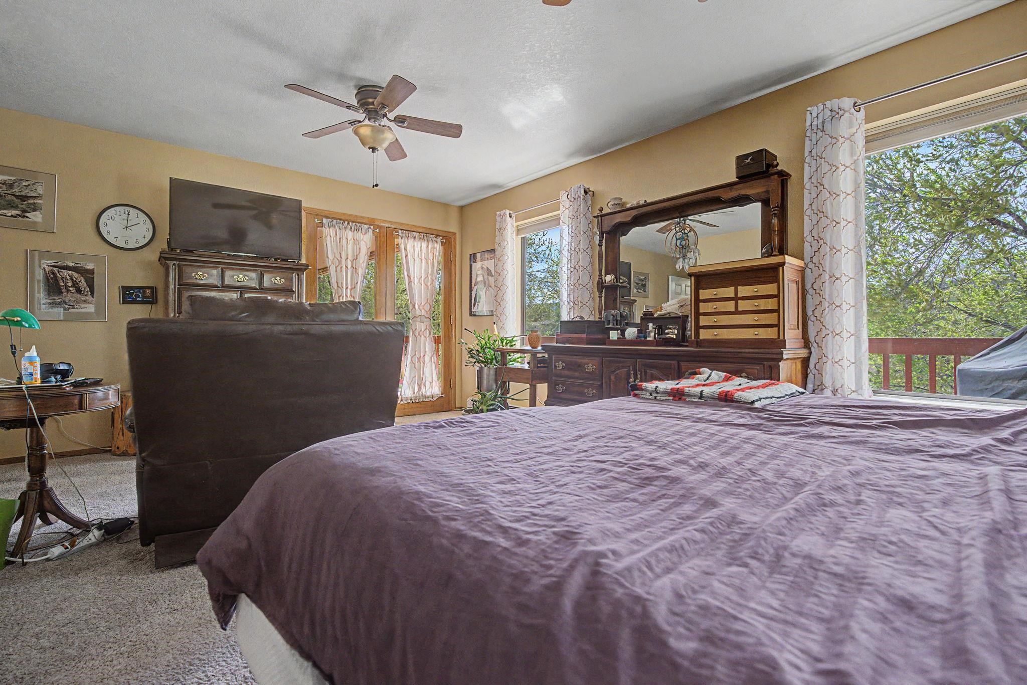 539 1/2 Ridgestone Court Grand Junction, CO 81507 - Photo 20 of 31 a bed sitting in a spacious bedroom next to a window