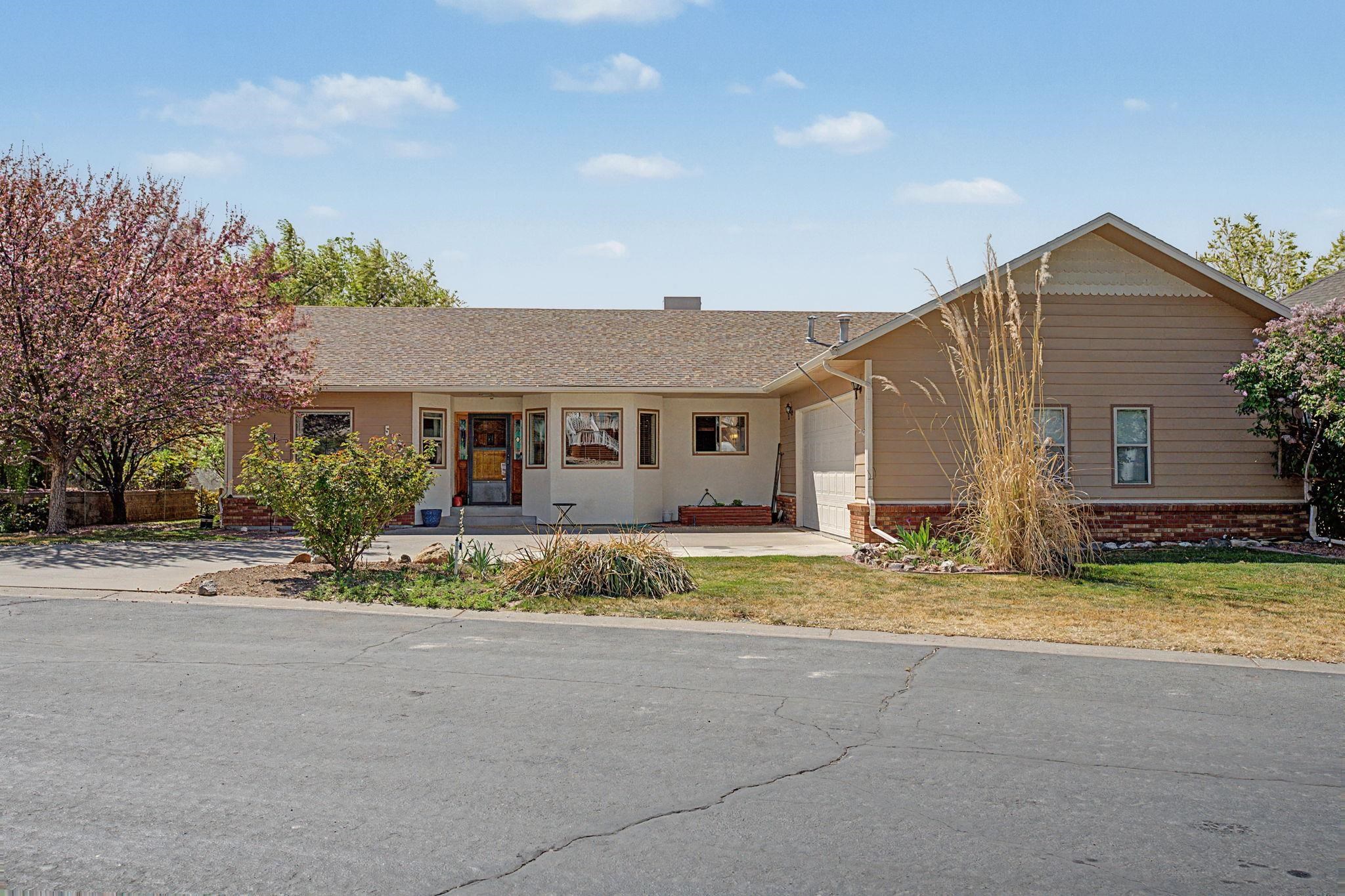 539 1/2 Ridgestone Court Grand Junction, CO 81507 - Photo 2 of 31 front view of a house with a patio