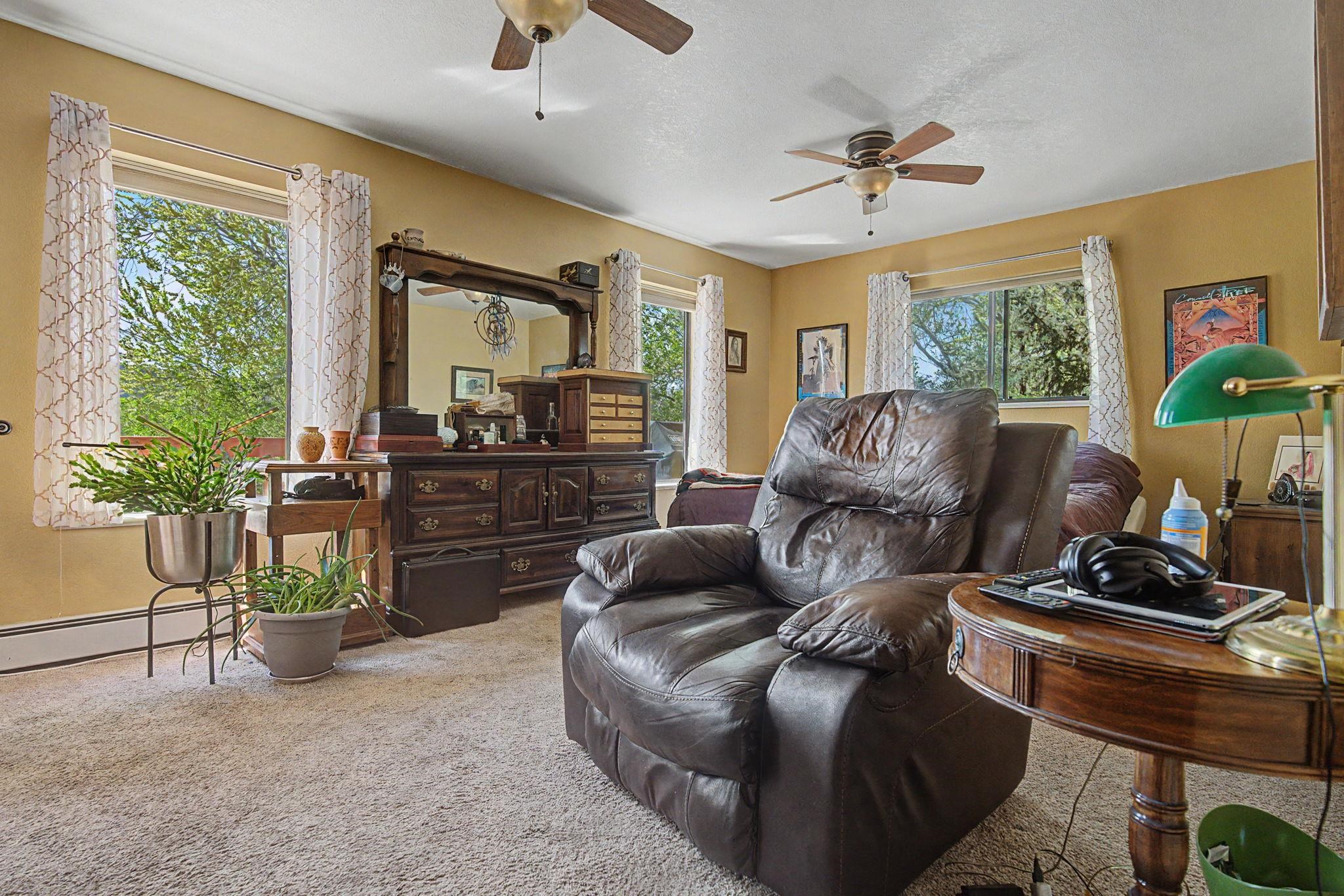 539 1/2 Ridgestone Court Grand Junction, CO 81507 - Photo 22 of 31 a living room with furniture and a flat screen tv