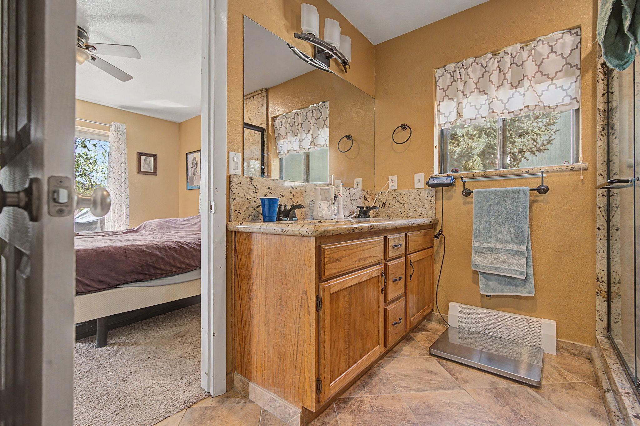 539 1/2 Ridgestone Court Grand Junction, CO 81507 - Photo 23 of 31 a en suite bathroom with a sink and a mirror
